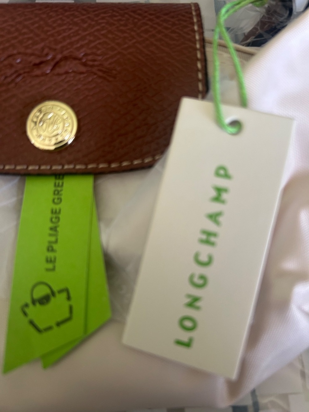 Compact cream nylon mini tote. Brown leather flap and top handle. Gold-tone butt - Picture 3 of 5